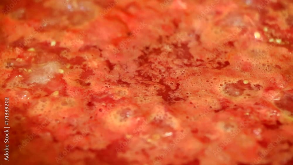 Cooking delicious tomato sauce closeup