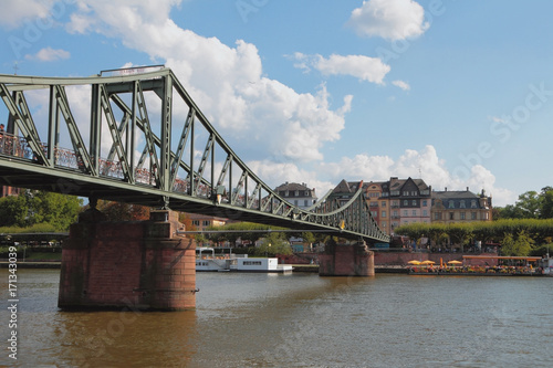 River and pedestrian iron bridge. Frankfurt am Main, Germany