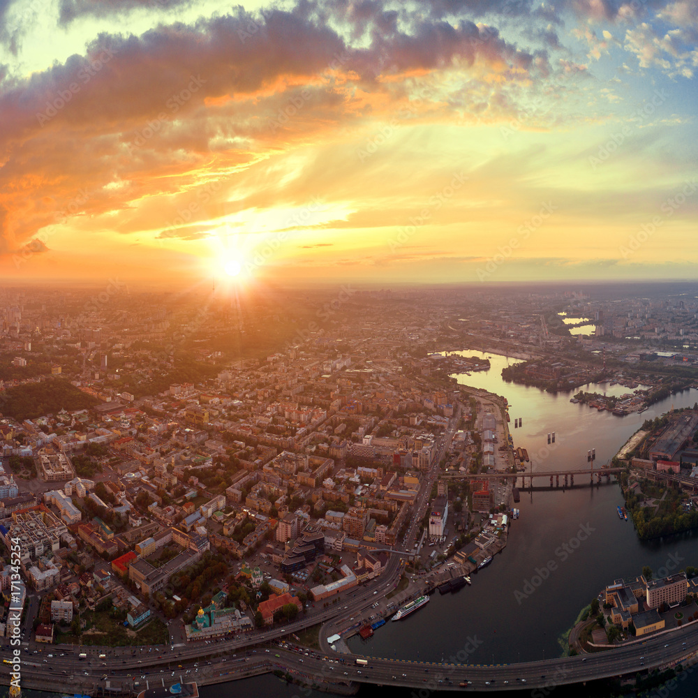 A big panorama of the city of Kiev on Podol at sunset.