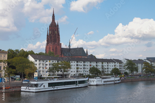 River, embankment, walking motor ships and cathedral. Frankfurt am Main, Germany