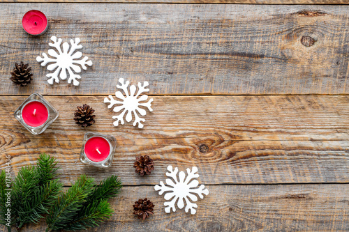 Christmas eve with spruce branches, toys and pine cones on wooden background top veiw mock-up