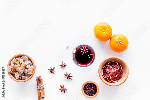 Ingredients mulled wine or grog with spices and citrus for winter evening. Christmas new year eve. White background top view. Space for text