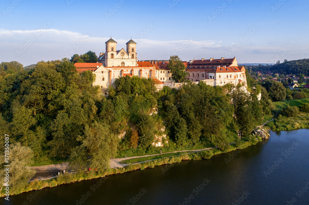Tyniec, Poland. Benedictine abbey on the rocky hill near Cracow and Vistula River. Aerial view at sunset