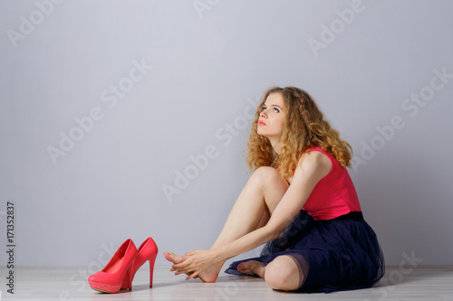 woman with pink high-heeled shoes