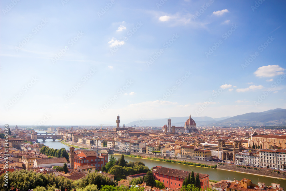 Beautiful cityscape skyline of Firenze (Florence), Italy, with the bridges over the river Arno, Famous View of Florence with sunny day, blue sky from Piazzale Michelangelo, Florence, Italy