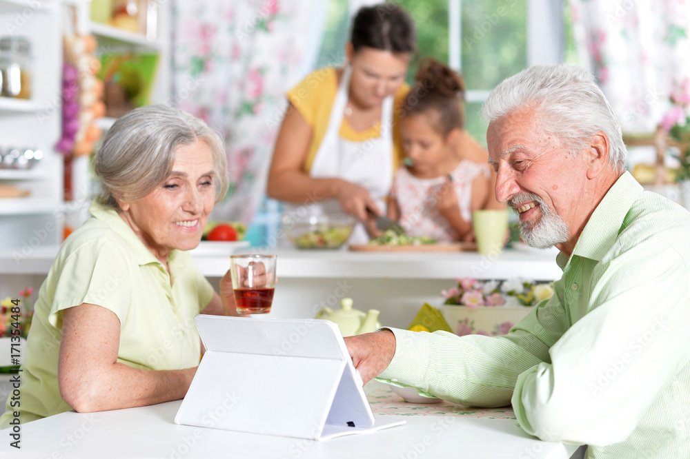 Senior couple looking at tablet