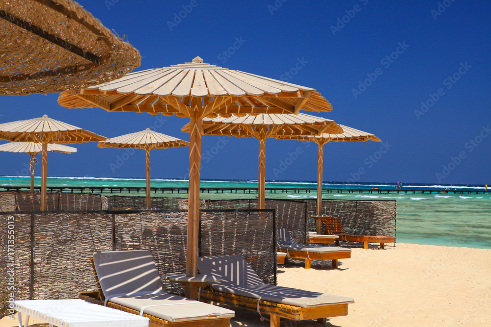 Egyptian parasol on the beach of Red Sea. Marsa Alam, Egypt.