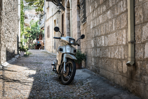 Motorbike at narrow street of Rhodes town on Rhodes island  Greece