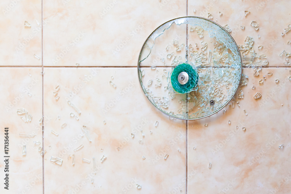 Fototapeta premium Broken glass lid on the floor.