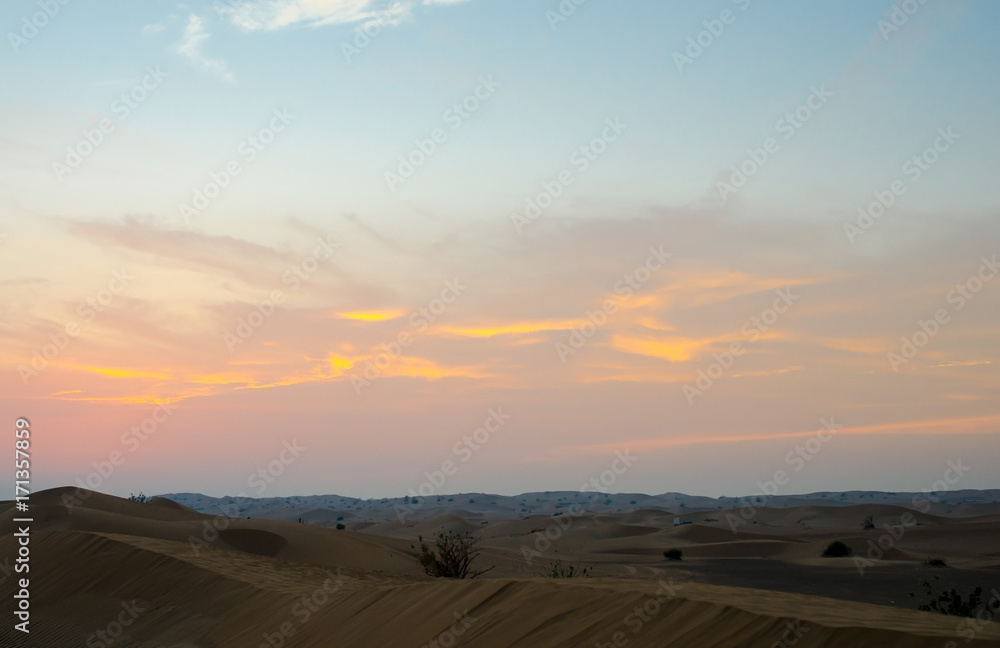 Arabian desert dunes landscape at sunset
