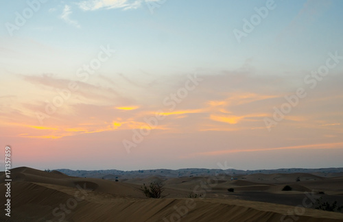 Arabian desert dunes landscape at sunset