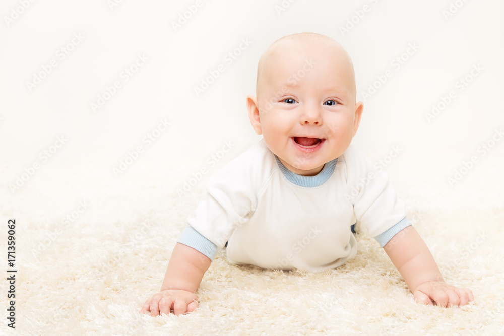 Baby Boy, Happy Infant Kid Portrait, Cute Smiling Child lying on stomach standing on arms Baby Boy, Happy Infant Kid Portrait, Cute Smiling Child lying on stomach standing on arms