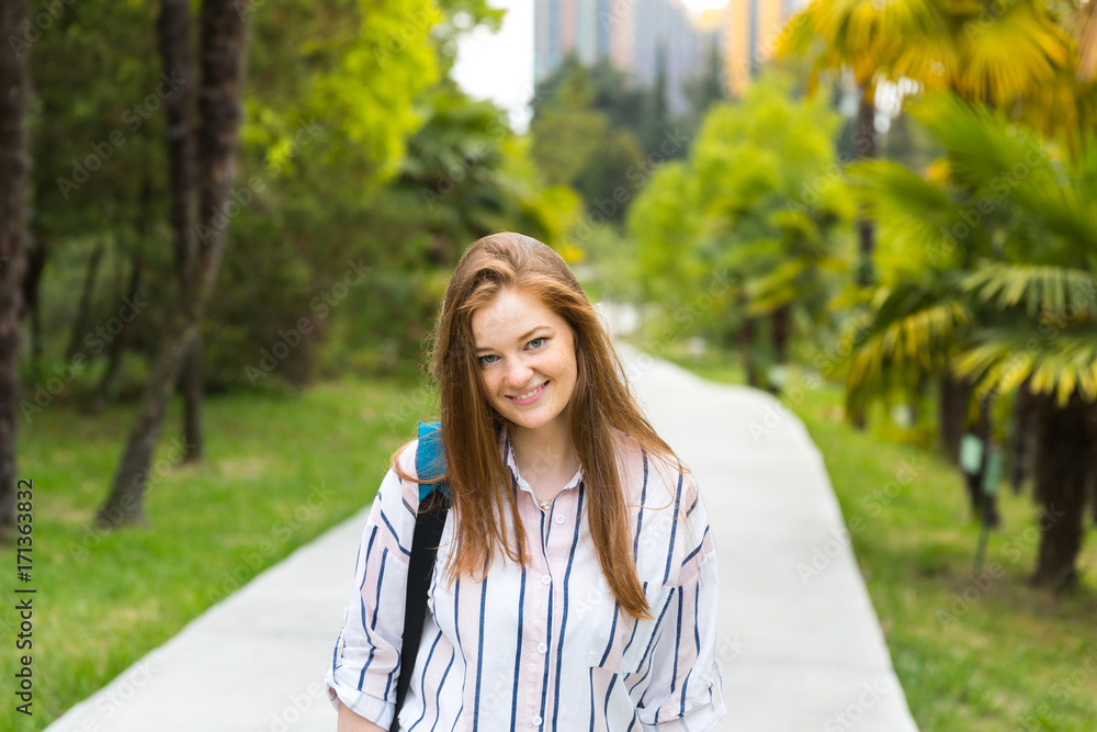 Study abroad. Happy student in the green city park. Self-confidence Study abroad. Happy student in the green city park. Self-confidence