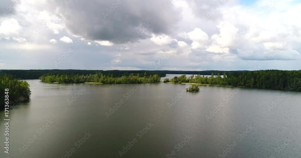 Cinematic lake, Cinema 4k aerial dark view of a pond, on a cloudy day, in Uusimaa, Finland Cinematic lake, Cinema 4k aerial dark view of a pond, on a cloudy day, in Uusimaa, Finland