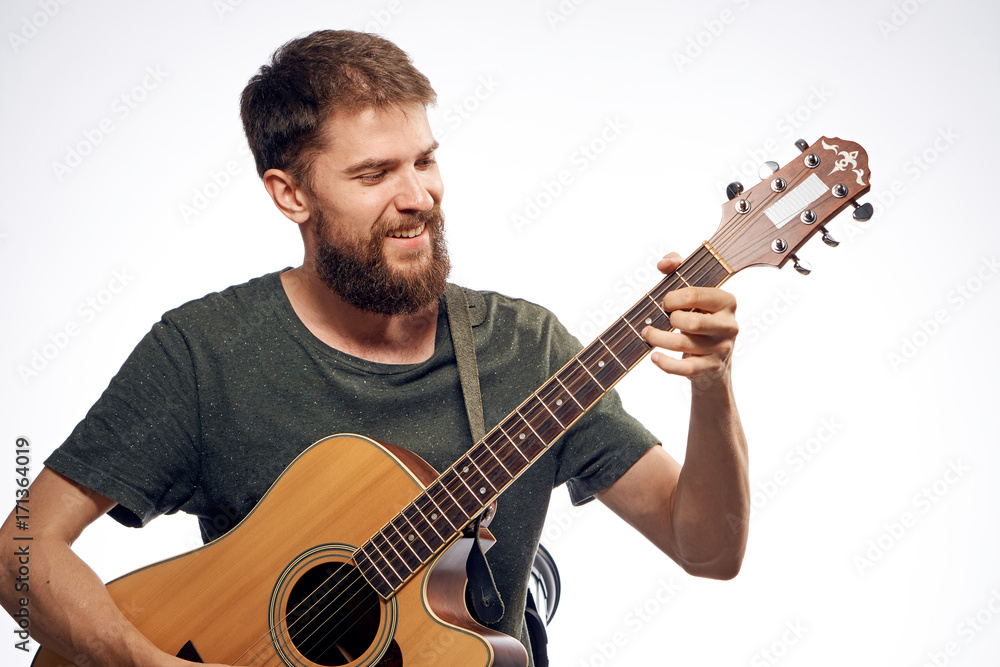 1456834 man playing guitar on white isolated background