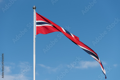 Norwegian flag against the blue sky
