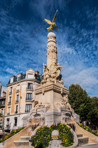 Ancient monumental fountain Sube with golden angel at top was erected in middle of Place d'Erlon, four statues represent Region Rivers: Marne, Vesle, Suippe and Aisne. Reims, Champagne-ardenne, France