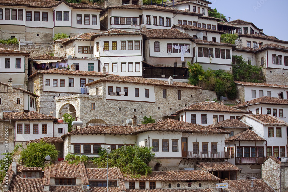 June 2014 - walls and windows of medieval houses built on a hillside in town Berat, Albania, inscribed on the UNESCO World Heritage List