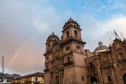 A rainbow over the Church of the Society of Jesus in Plaza de Armas in Cusco, Peru
