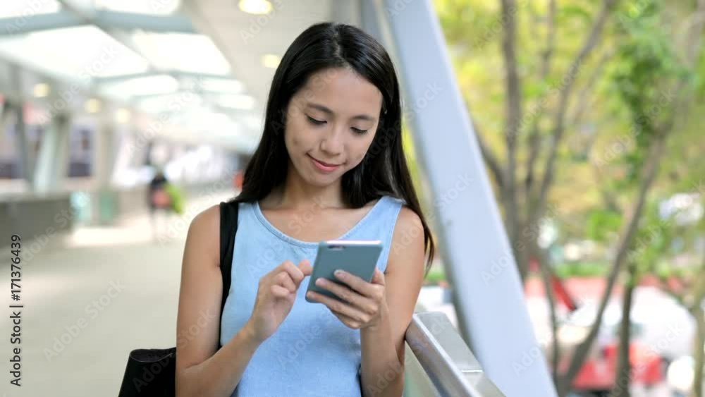 Woman hands typing sms scrolling pictures phone Woman hands typing sms scrolling pictures phone