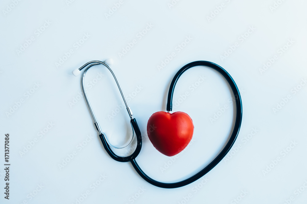 close up red heart and stethoscope on white background, world health day concept, process vintage tone close up red heart and stethoscope on white background, world health day concept, process vintage tone