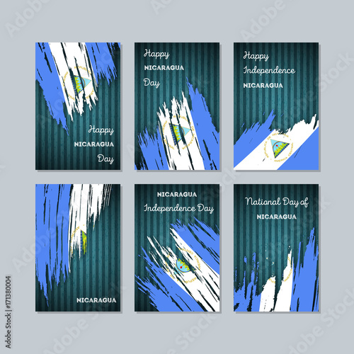 Nicaragua Patriotic Cards for National Day. Expressive Brush Stroke in National Flag Colors on dark striped background. Nicaragua Patriotic Vector Greeting Card.