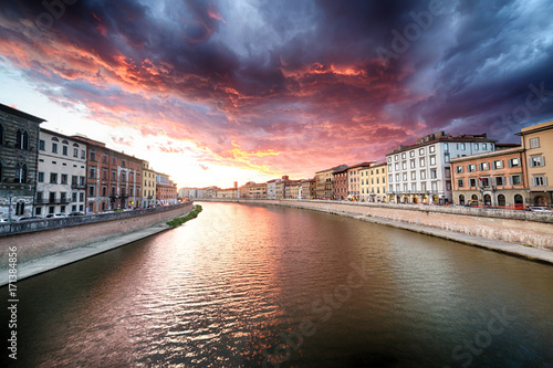 scenic sunset on river in Pisa