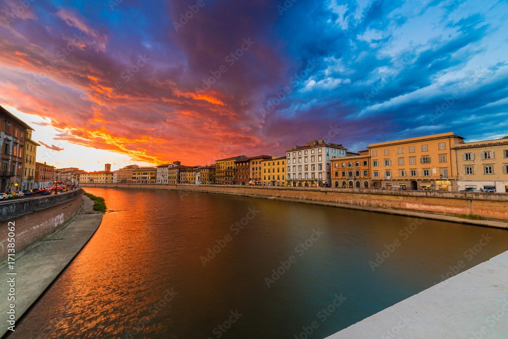 scenic sunset on river in Pisa