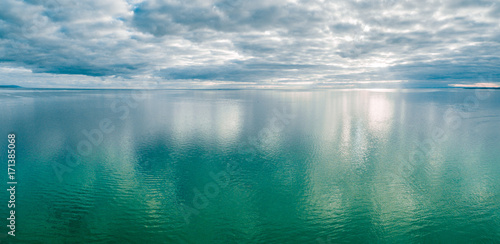 Aerial panorama of ocean water and sky
