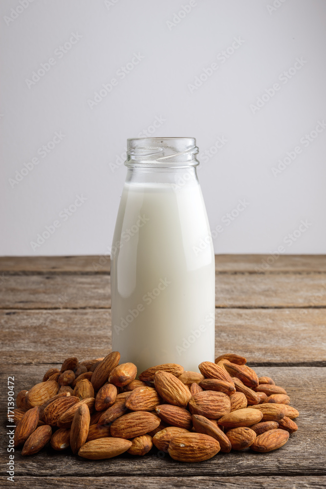 almond milk in bottle with Almonds almond milk in bottle with Almonds
