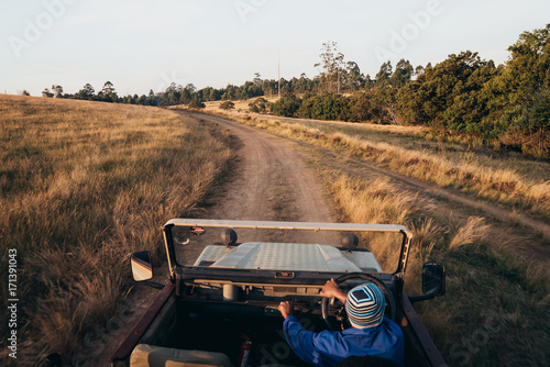 Man traveling through safari in the car 