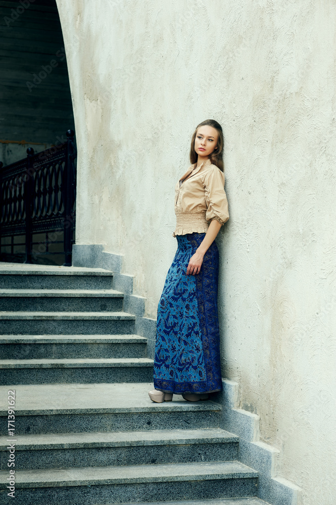 Fashion model on the street . Stylish young woman in trendy clothes.