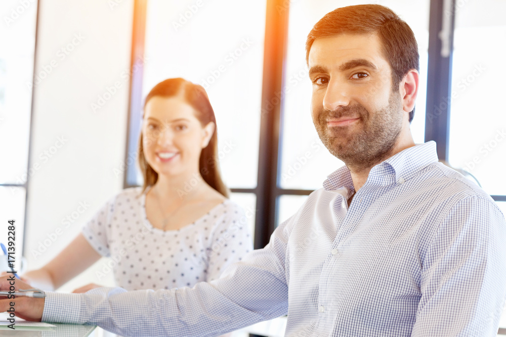 Fototapeta premium Image of two young business people in office