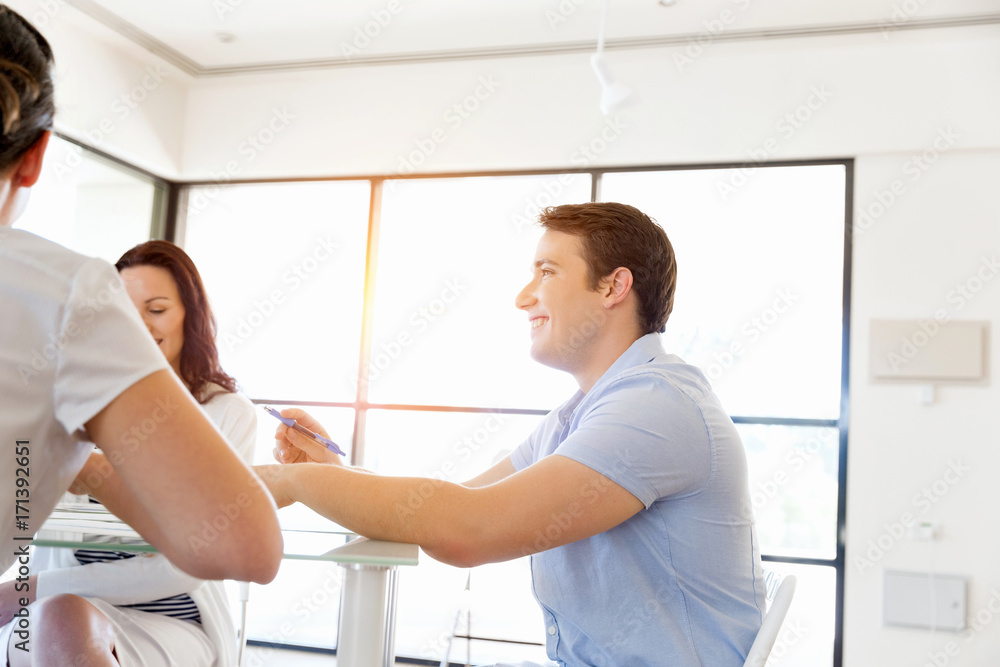 Fototapeta premium Image of business partners discussing documents and ideas