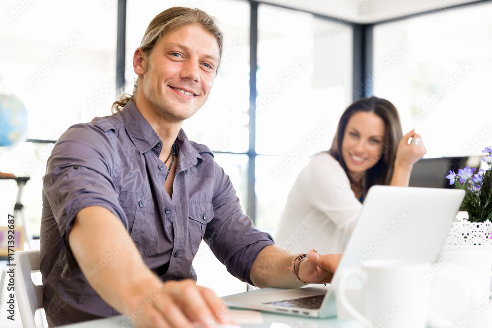Handsome businessman working at computer Handsome businessman working at computer