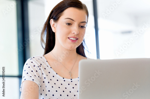 Portrait of businesswoman working at computer in office Free Download Portrait of businesswoman working at computer in office - GFXLoad