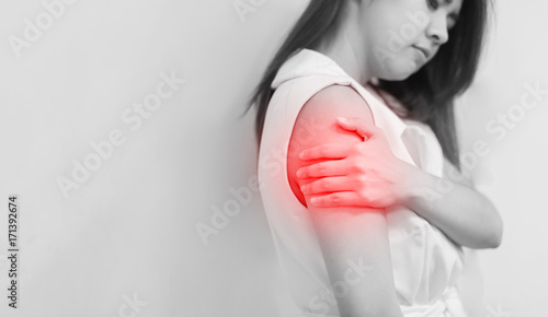 Woman with pain in shoulder and upper arm. Ache in human body, Office syndrome concept.