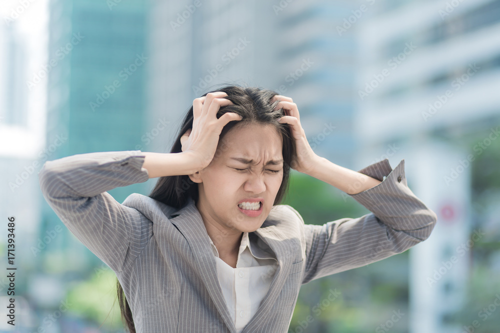 Portrait of Stressed business woman in the city. Portrait of Stressed business woman in the city.