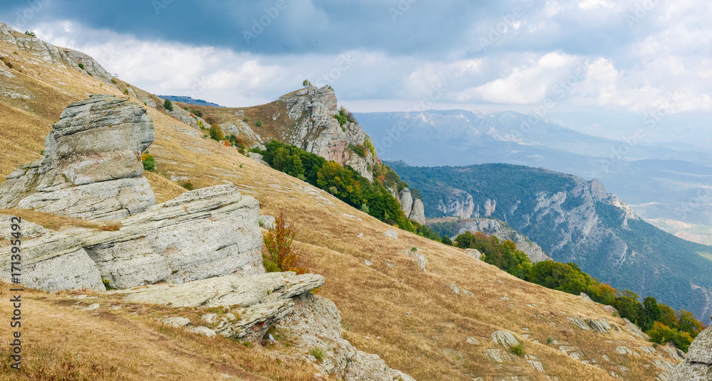 Mountain landscape with weathered rocks on a foreground