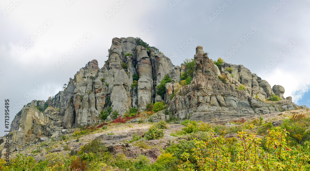 Panorama of the hillside with weathered rocks