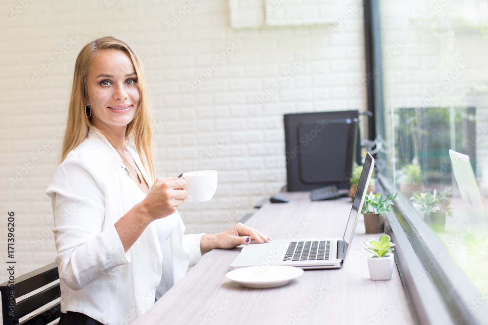 Woman using Laptop for Work at office. Smiling Businesswoman work at office Concept. Woman using Laptop for Work at office. Smiling Businesswoman work at office Concept.