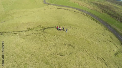 Tour guide and walkers at Knockdhu Barrows Northern Ireland photo