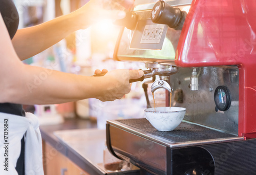 Hand woman making coffee cup machine