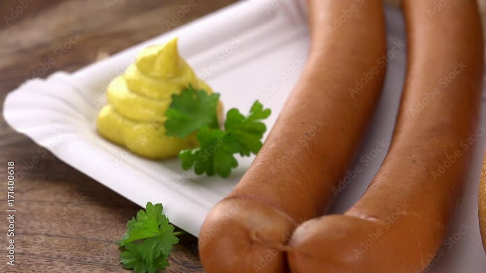 Wiener Sausage on a rotating wooden plate (seamless loopable; 4K) Wiener Sausage on a rotating wooden plate (seamless loopable; 4K)