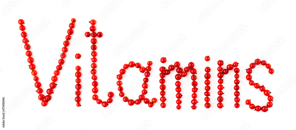Vitamins. Words are made up of natural fresh organic berries of red currant on a white background. Top view Vitamins. Words are made up of natural fresh organic berries of red currant on a white background. Top view