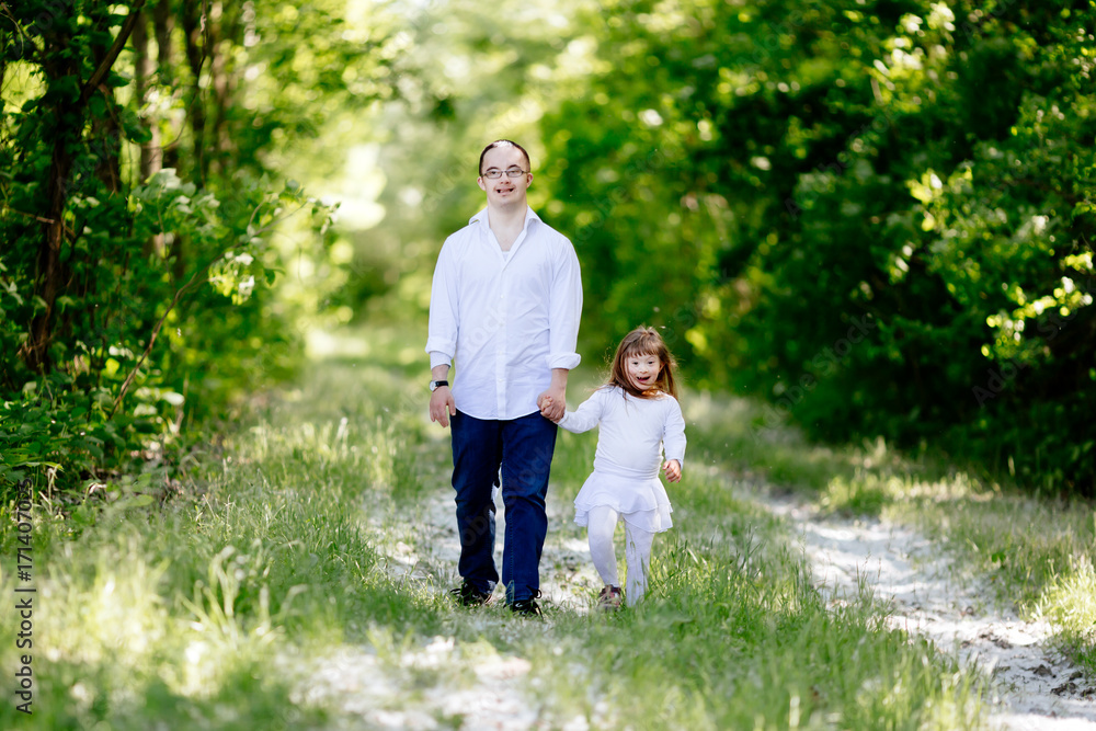 People with down sydrome walking in forest People with down sydrome walking in forest