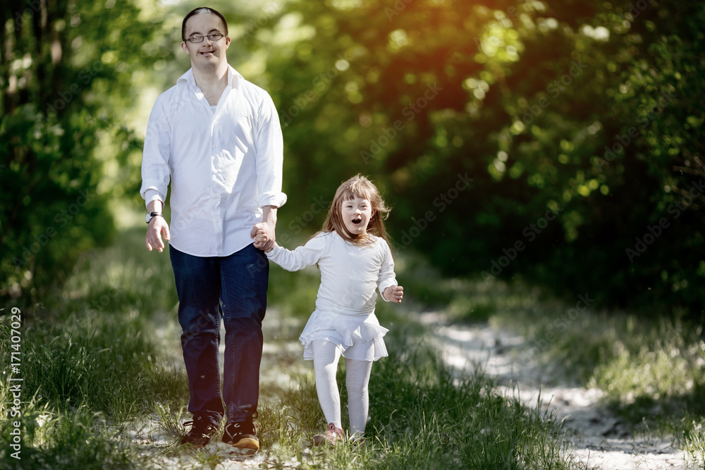 Fototapeta premium People with down sydrome walking in forest