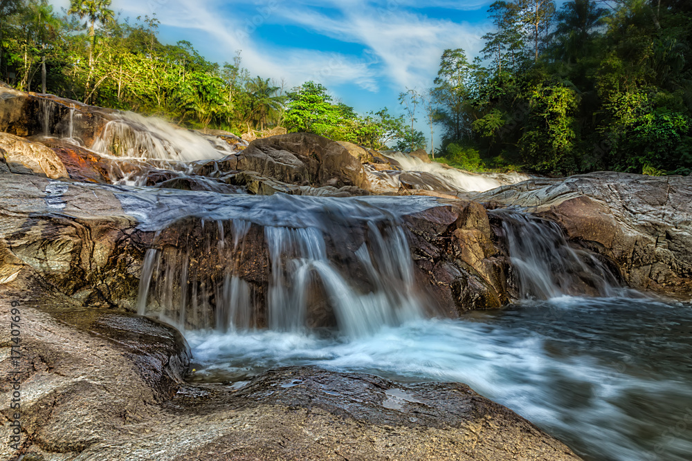 Obraz premium Small waterfall and stone with water motion.