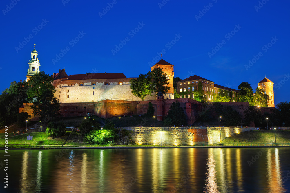 Night view of the Vistula River and Wawel Castle in the Polish city of Krakow.
