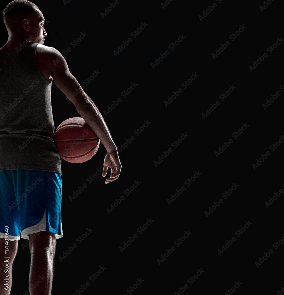 The hand of a basketball player with ball The hand of a basketball player with ball